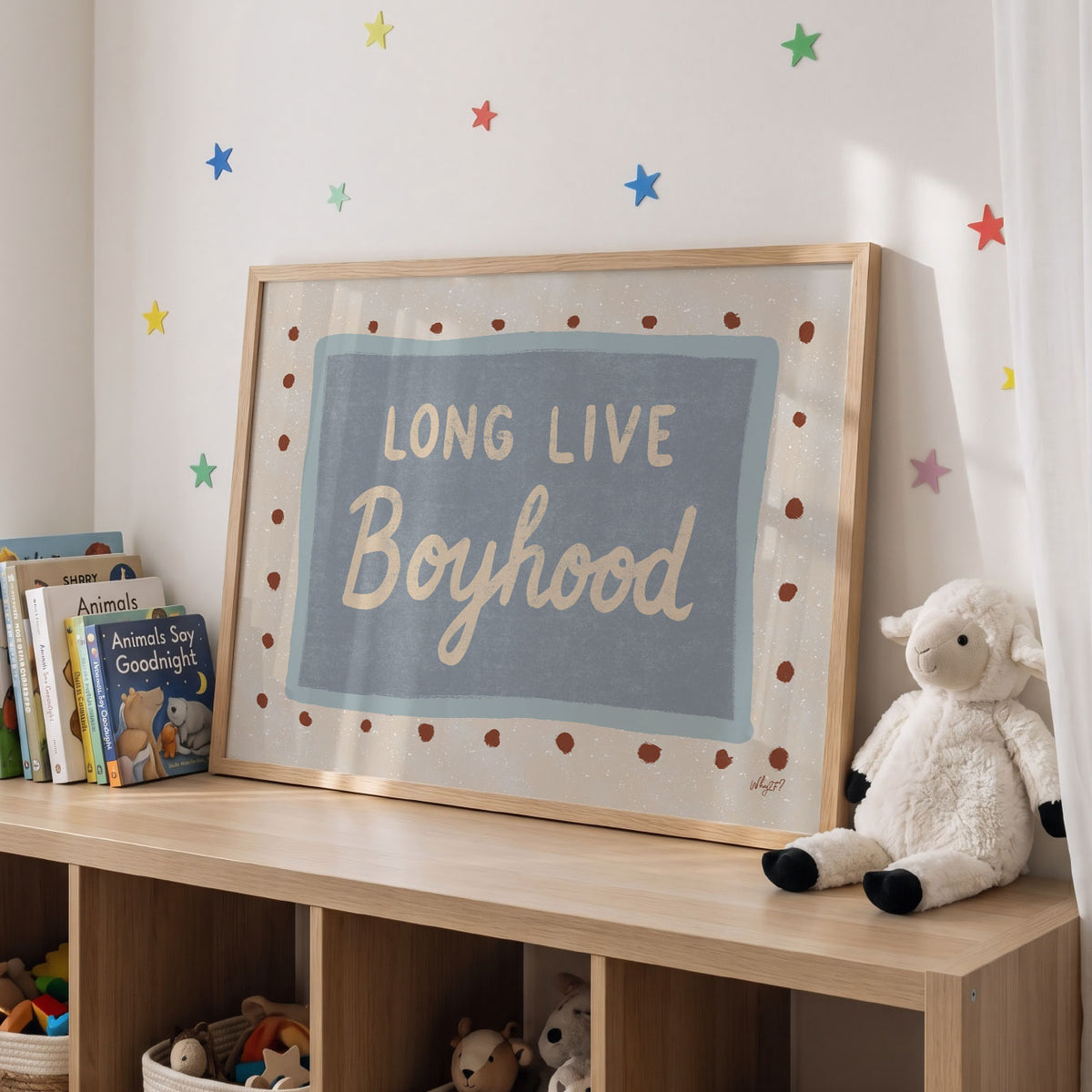 Landscape poster with the hand lettered words long live boyhood on a blue panel