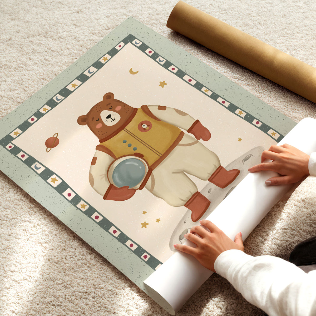 Illustrated poster of a brown bear in a spacesuit standing on the moon inside a star patterned border