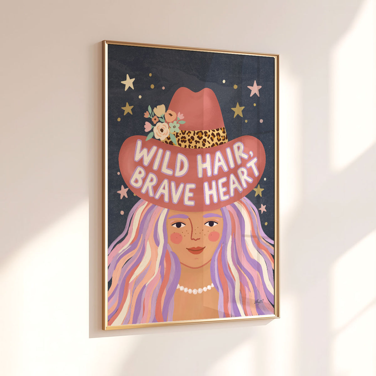 Illustrated poster of a girl in a pink cowboy hat lettered wild hair brave heart on a starry sky