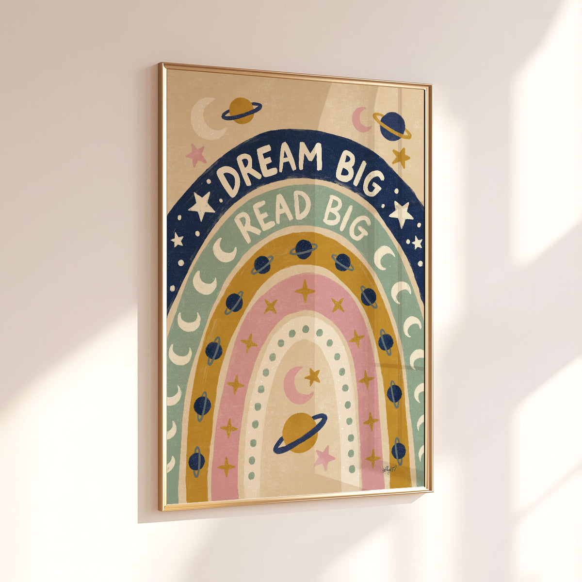 Illustrated poster of a rainbow filled with planets and stars lettered dream big read big
