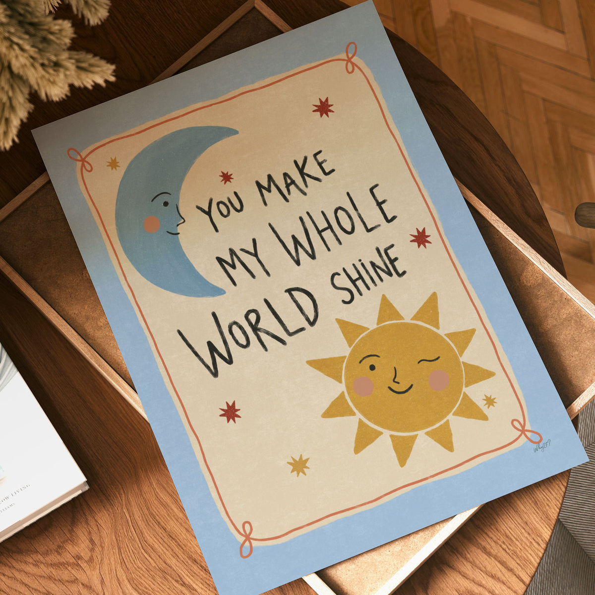 Illustrated poster with a moon and sun around the words you make my whole world shine
