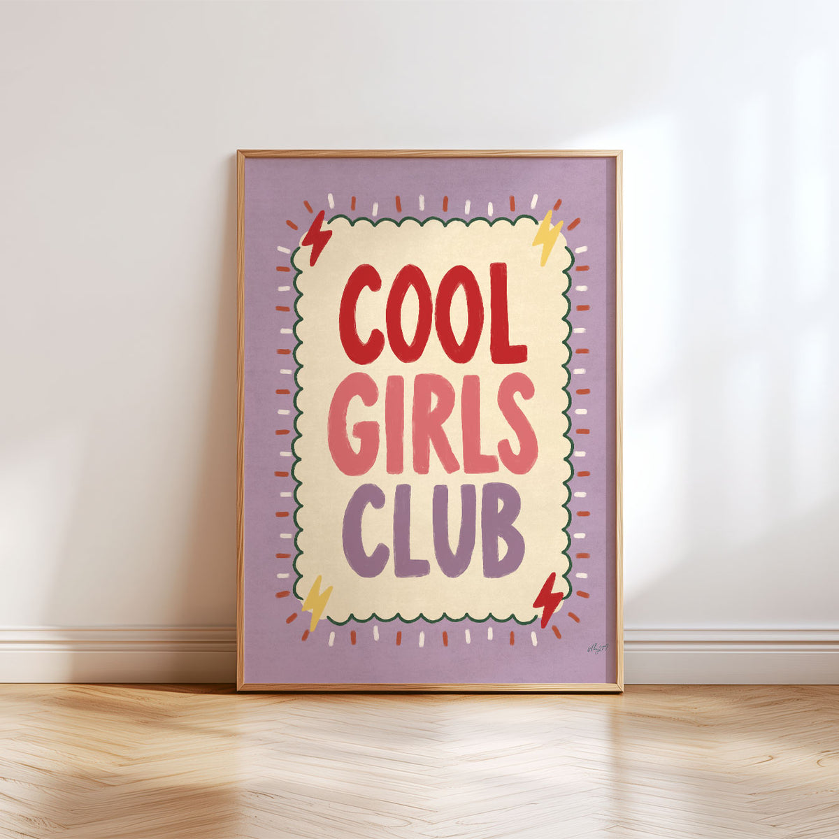Bold hand-painted lettering reading Cool Girls Club in red, coral and lilac inside a scalloped green border on a lilac background.