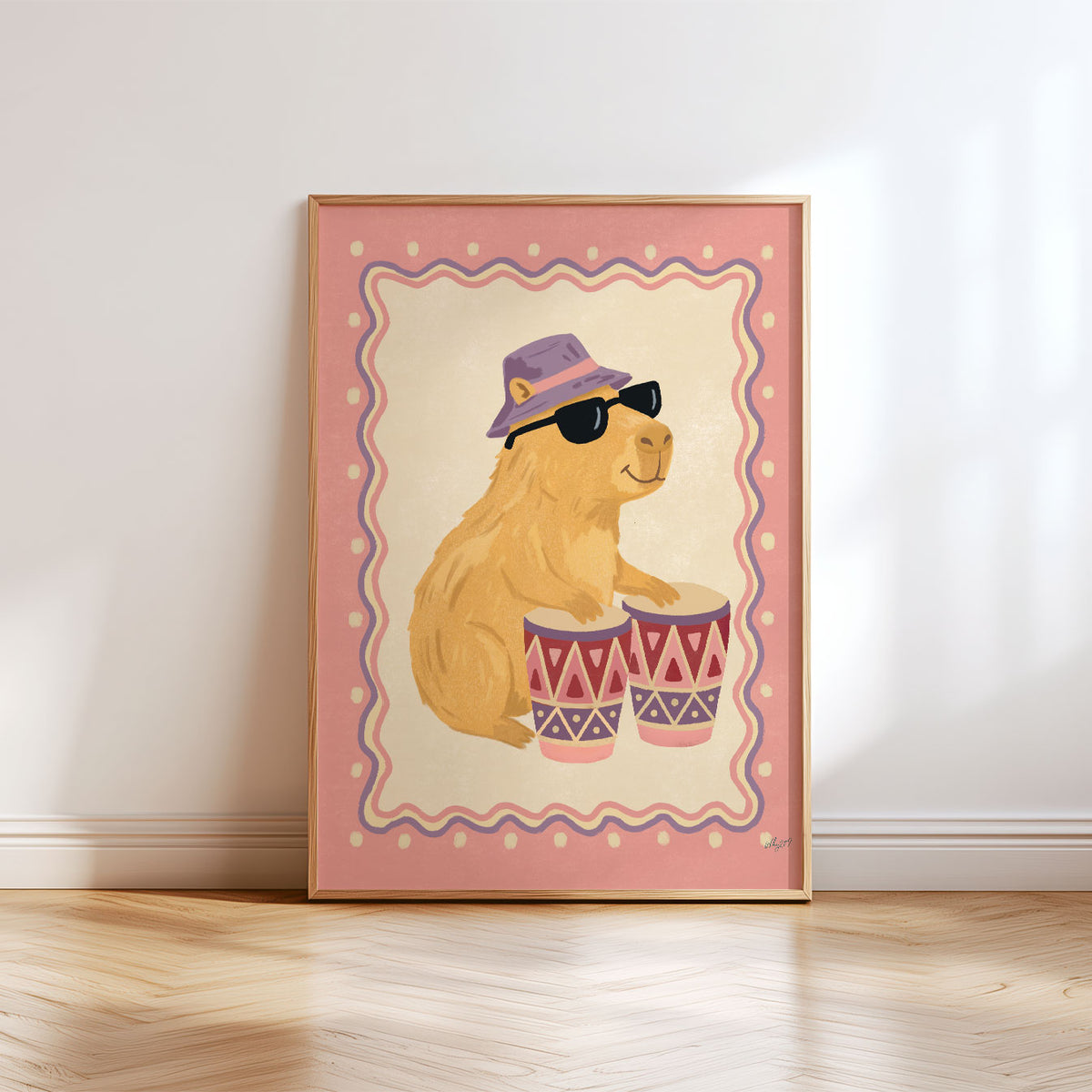 Illustrated capybara in sunglasses and a lilac bucket hat playing bongo drums, inside a wavy border on a dusty pink background.