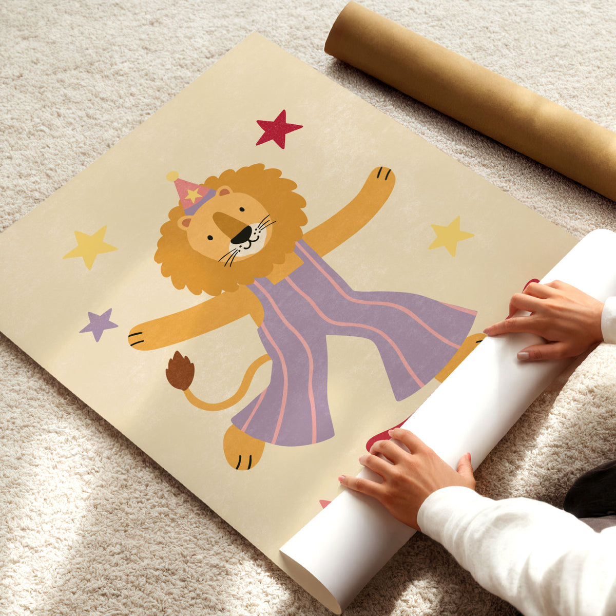 Illustrated lion wearing a party hat and lilac striped overalls riding a red skateboard surrounded by stars on a cream background.