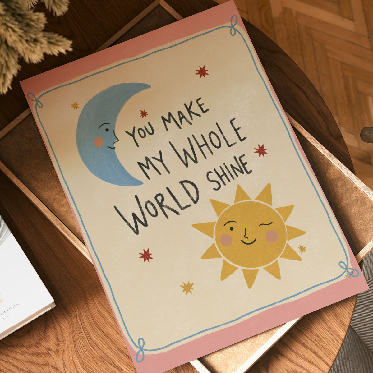 Hand-lettered quote reading You Make My Whole World Shine with a smiling sun and crescent moon, on a warm pink background.