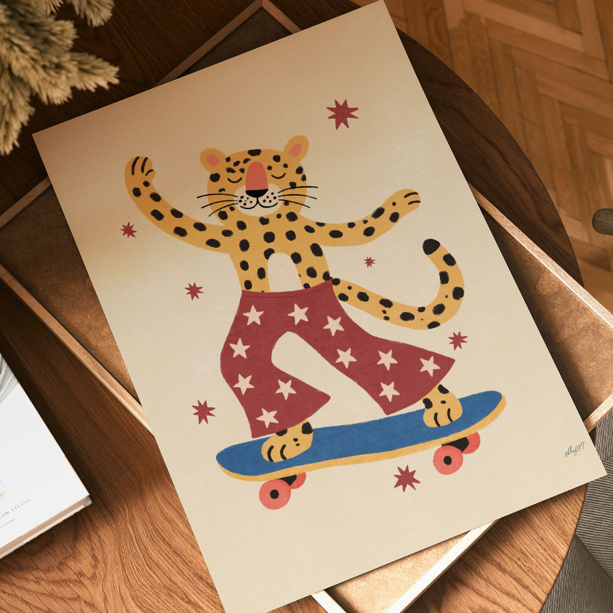 Illustrated poster of a leopard riding a skateboard in red star-print pants with one arm raised, surrounded by small stars