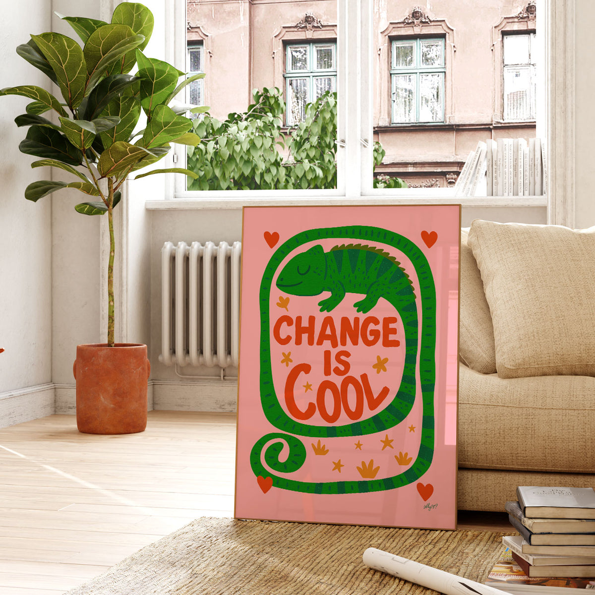 Positive kids wall art featuring Change Is Cool lettering with a playful green chameleon on a pink background.