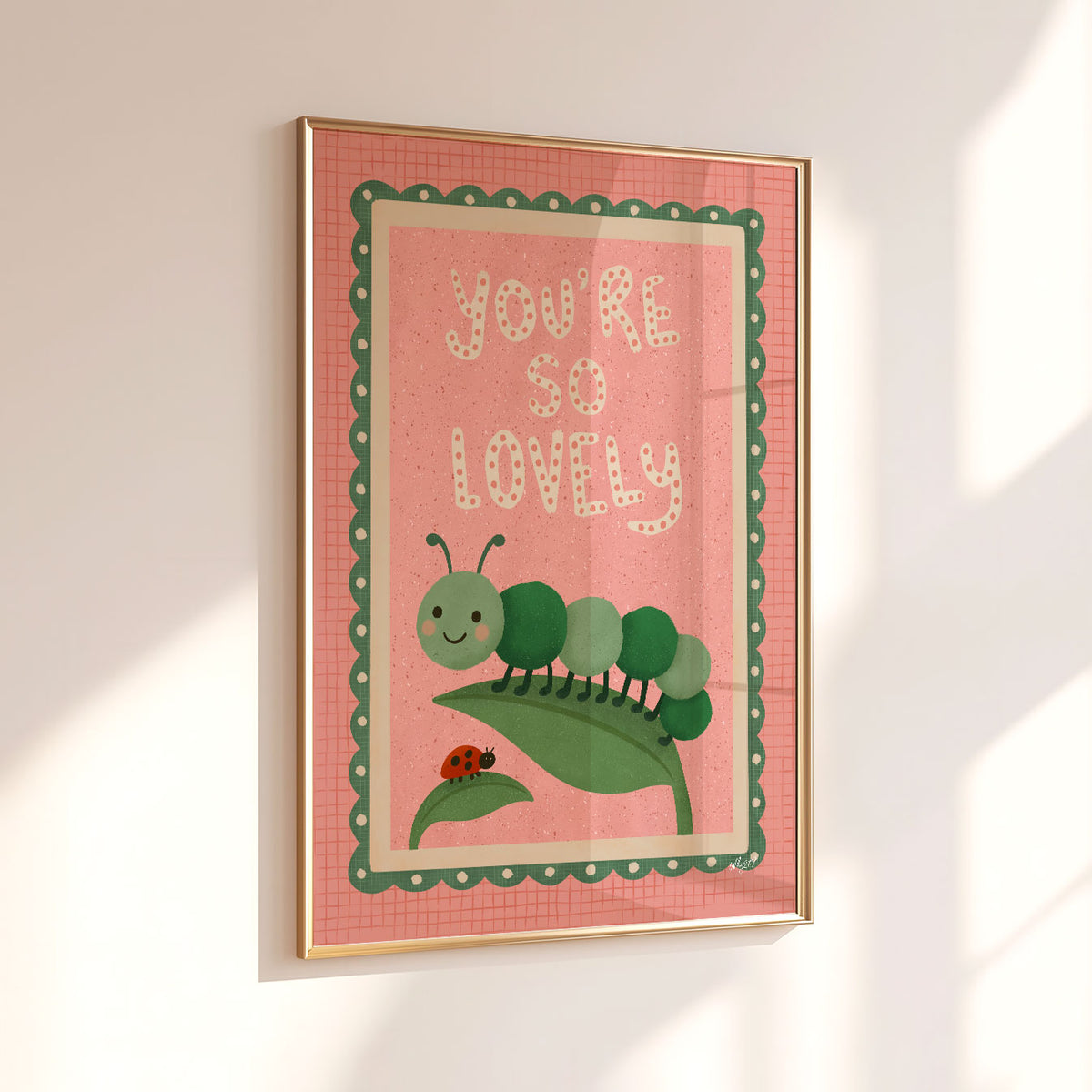 You’re So Lovely wall art in pink and green with hand-drawn lettering and friendly garden characters.