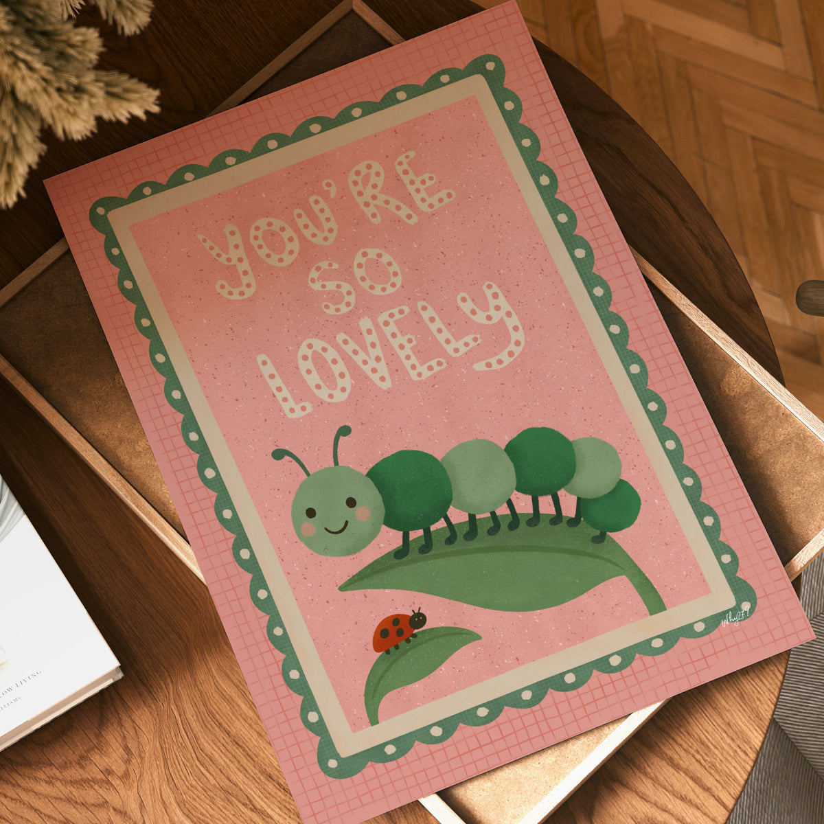 Retro caterpillar kids poster with positive quote, leafy illustration and scalloped green border for a nursery or bedroom.