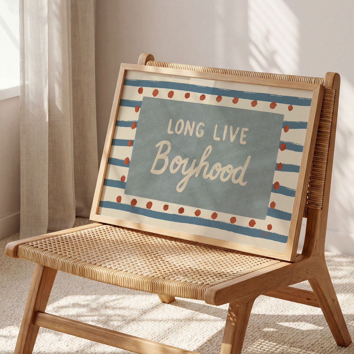 Landscape poster with the words long live boyhood on a blue panel over stripes