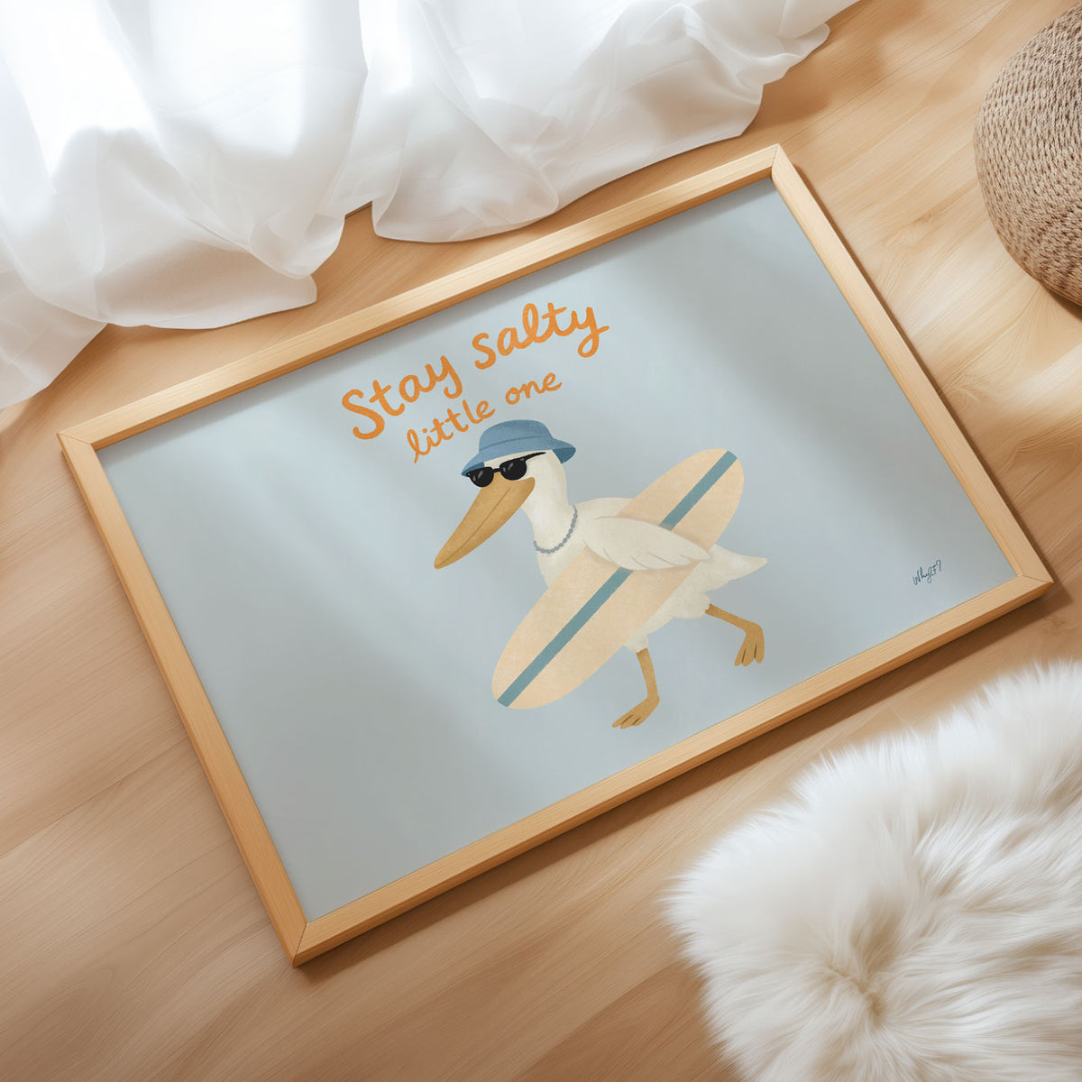 Landscape poster of a pelican with a surfboard under the words stay salty little one