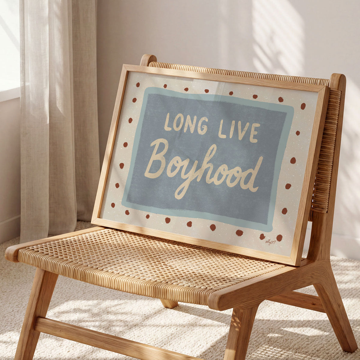Landscape poster with the hand lettered words long live boyhood on a blue panel