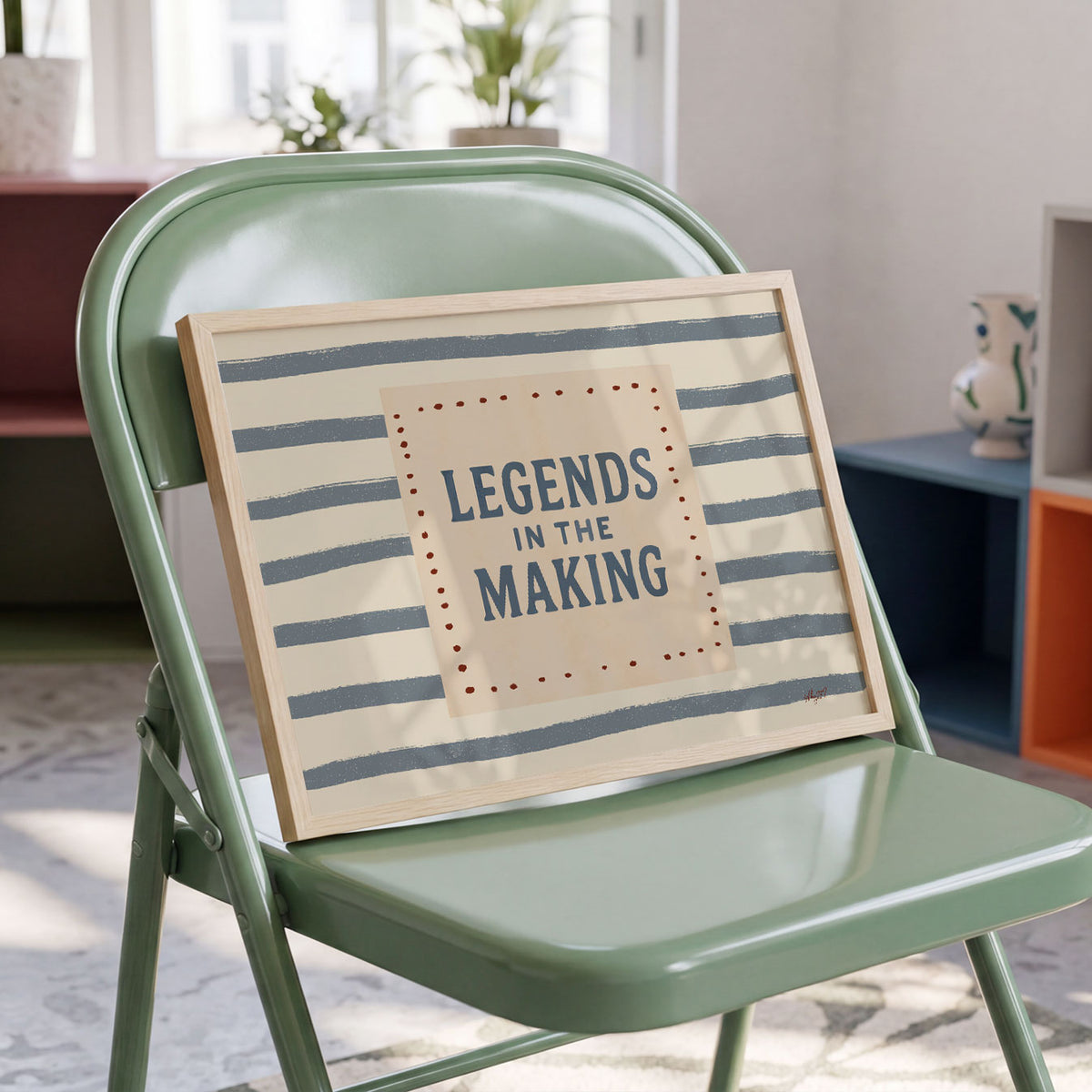 Landscape poster with the hand lettered words legends in the making over painted stripes