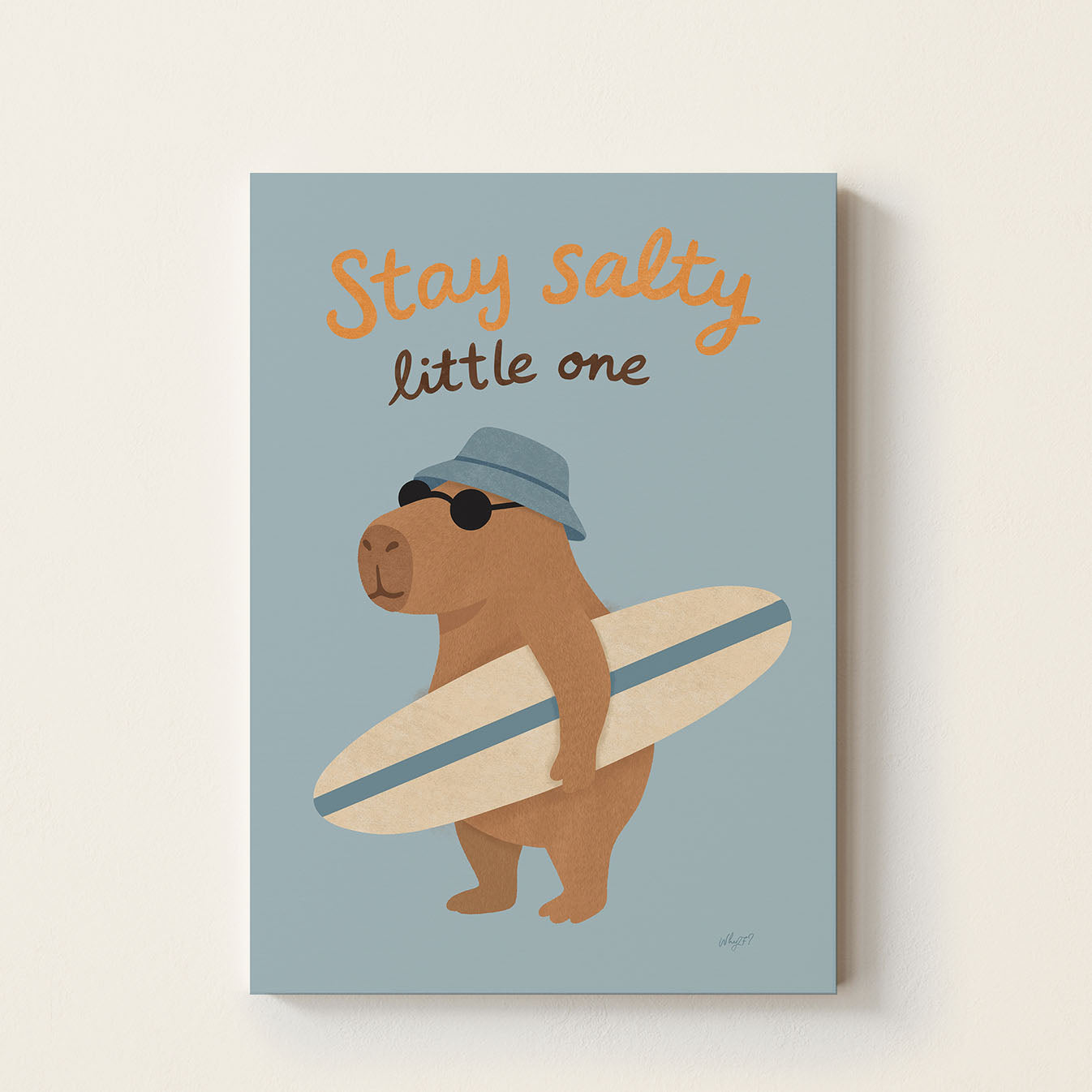 Hand-drawn capybara wearing sunglasses and a blue bucket hat while holding a surfboard beneath the words "Stay Salty Little One", whimsical coastal wall art for nurseries, bedrooms, and playrooms.
