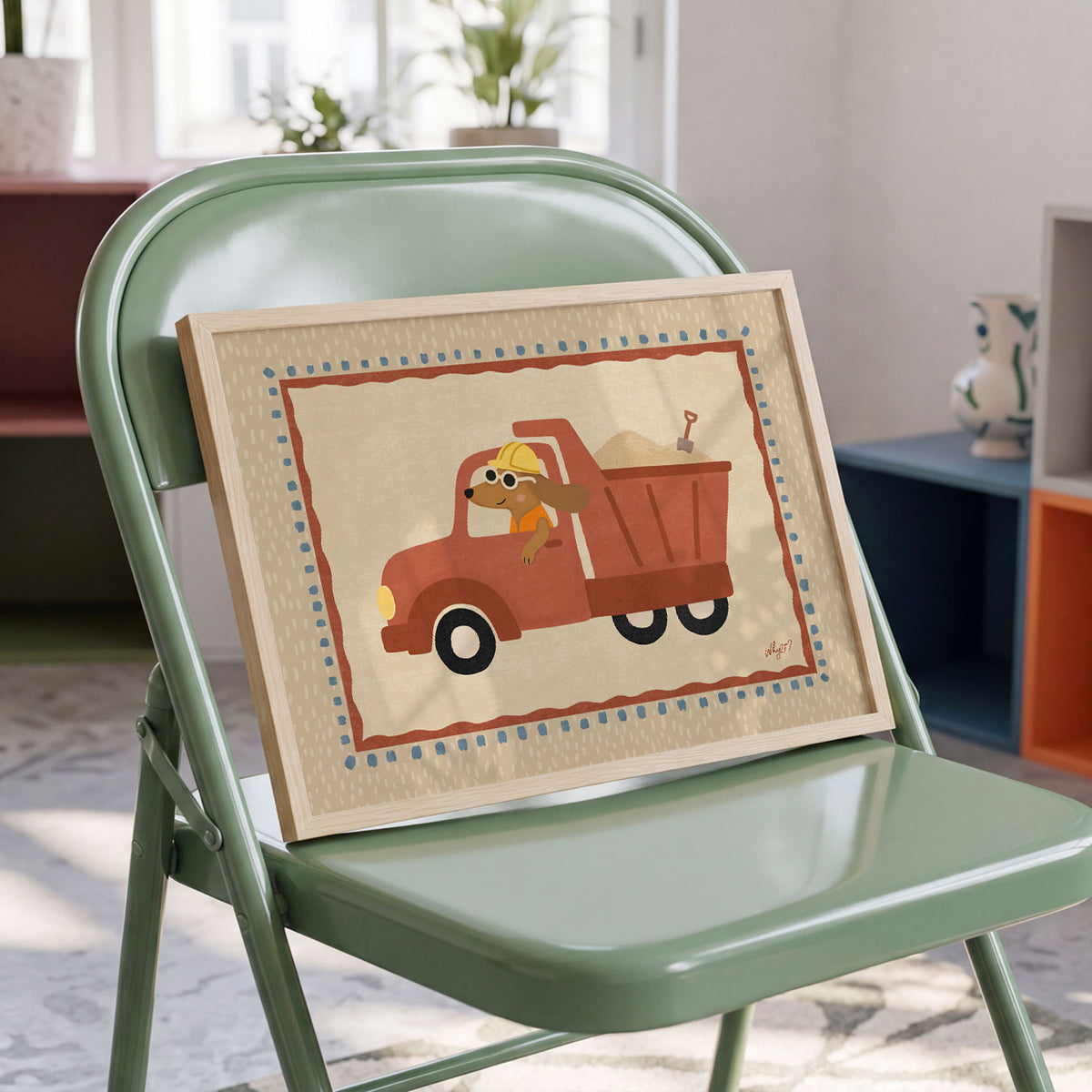 Landscape poster of a dog in a hard hat driving a red dump truck full of sand