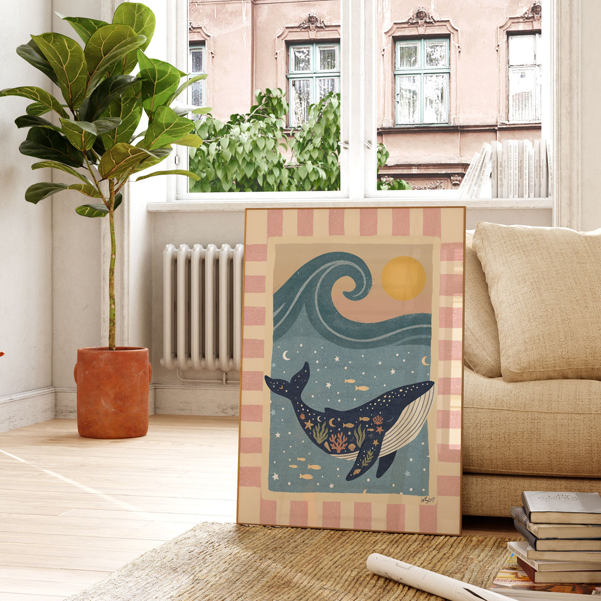 Hand-drawn whale poster in deep blue, pink and golden tones with a striped decorative border.