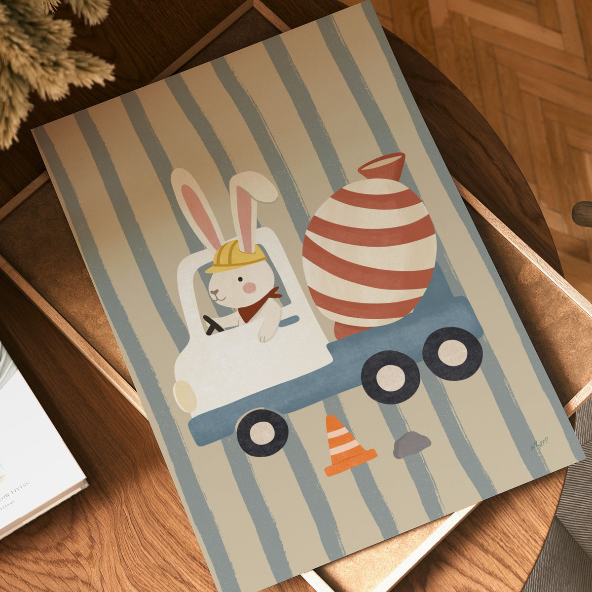 Illustrated poster of a bunny in a hard hat driving a striped cement mixer truck on a striped background