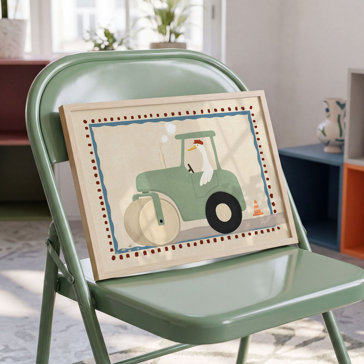 Illustrated poster of a goose in a beret driving a sage green steamroller with steam rising and a traffic cone beside the road