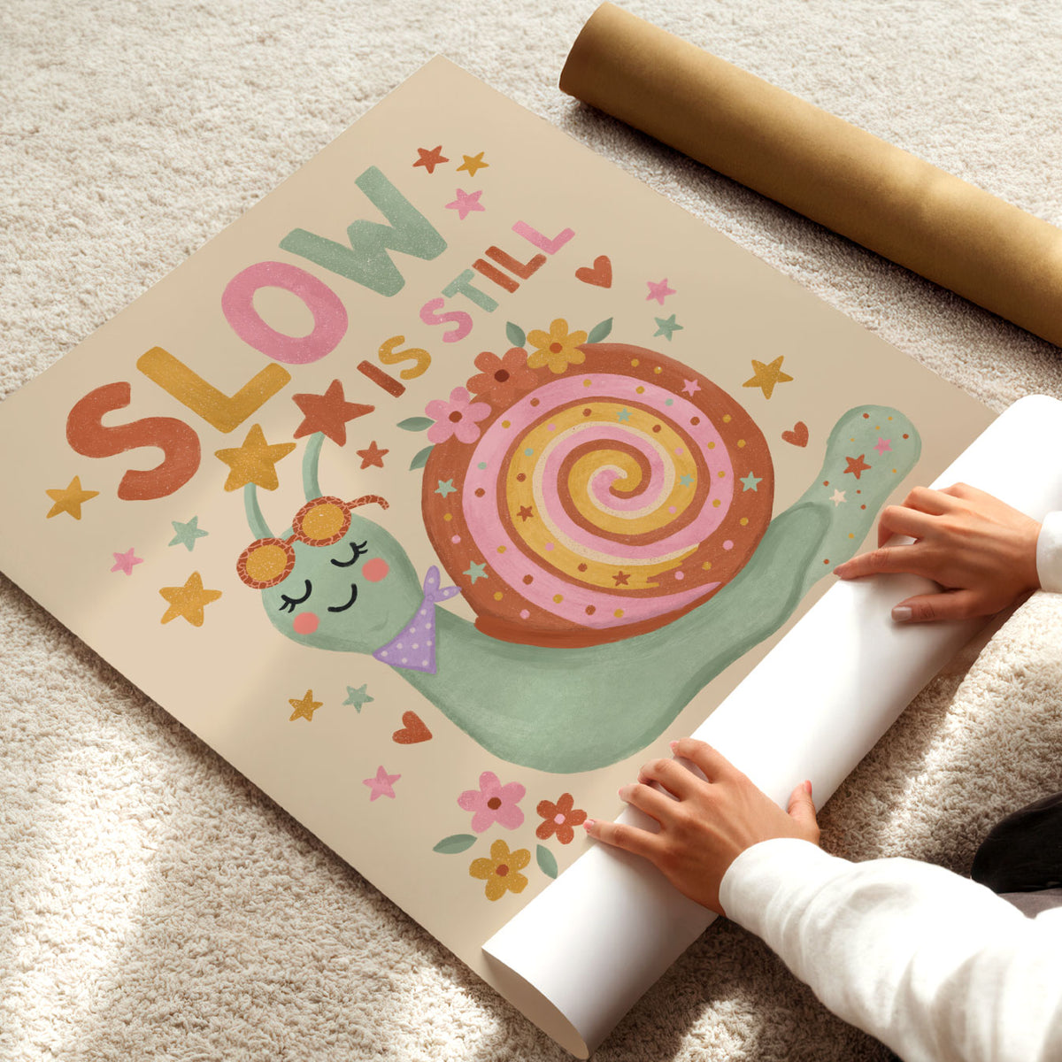 Illustrated poster of a smiling snail in sunglasses with the words slow is still forward