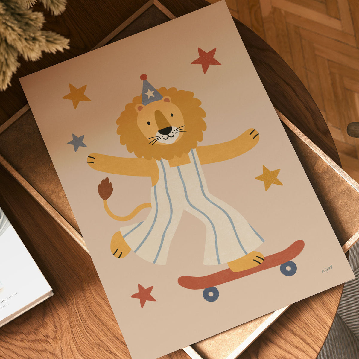 Illustrated poster of a lion in striped dungarees and a party hat riding a red skateboard