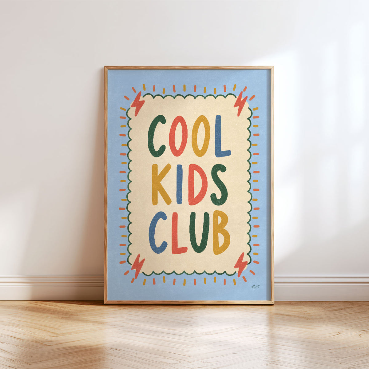 Illustrated poster with the hand lettered words cool kids club on a cream scalloped card