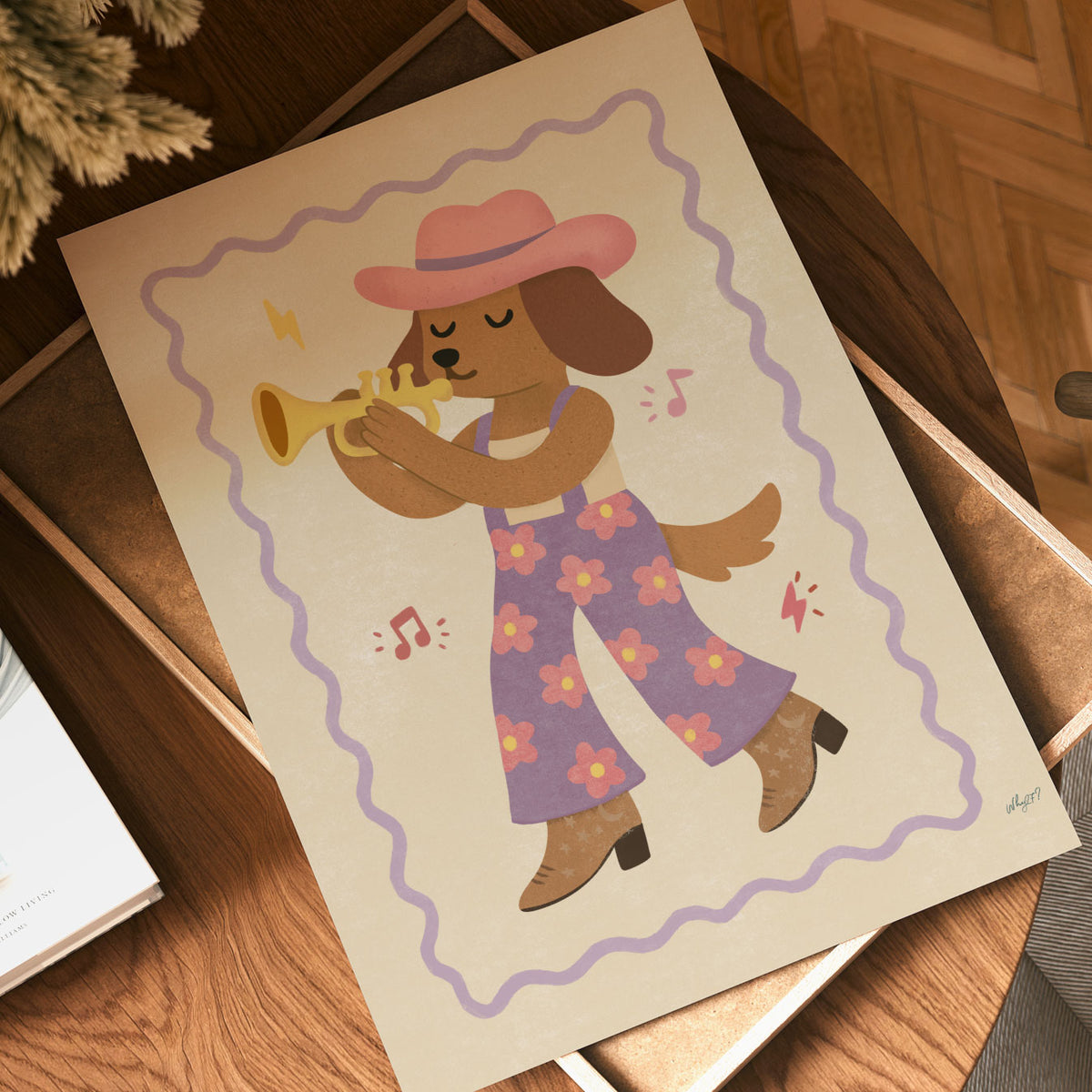 Illustrated dog in a pink cowboy hat and lilac floral overalls playing a golden trumpet on a cream background with a wavy lilac border.