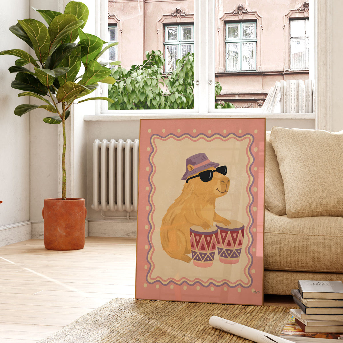 Illustrated capybara in sunglasses and a lilac bucket hat playing bongo drums, inside a wavy border on a dusty pink background.