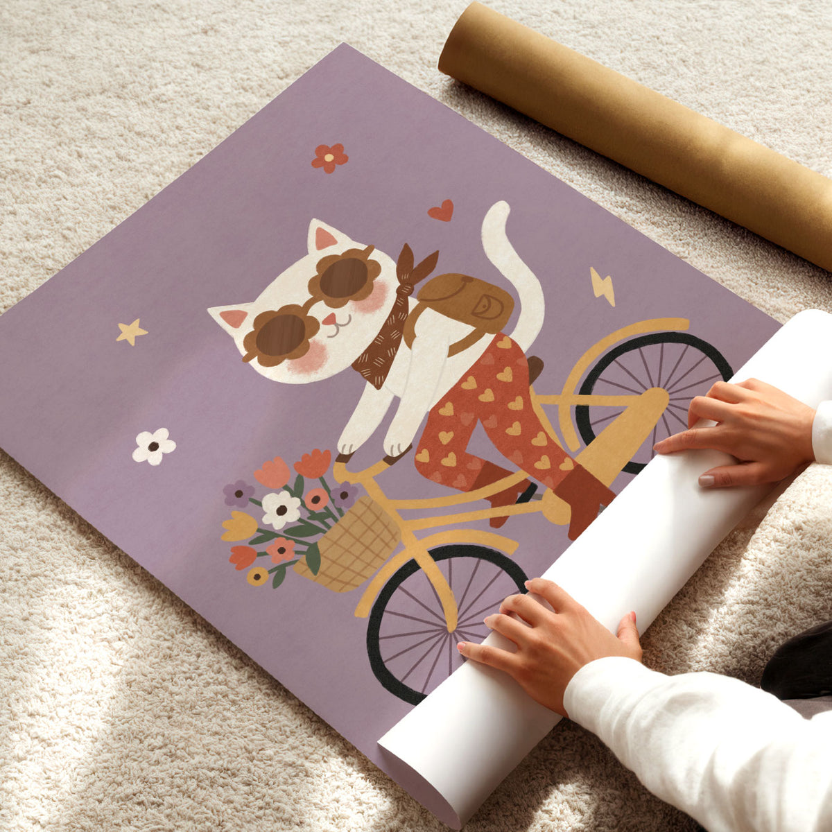 Illustrated white cat in flower-shaped sunglasses riding a yellow bicycle with a basket of flowers, on a dusty lilac background.
