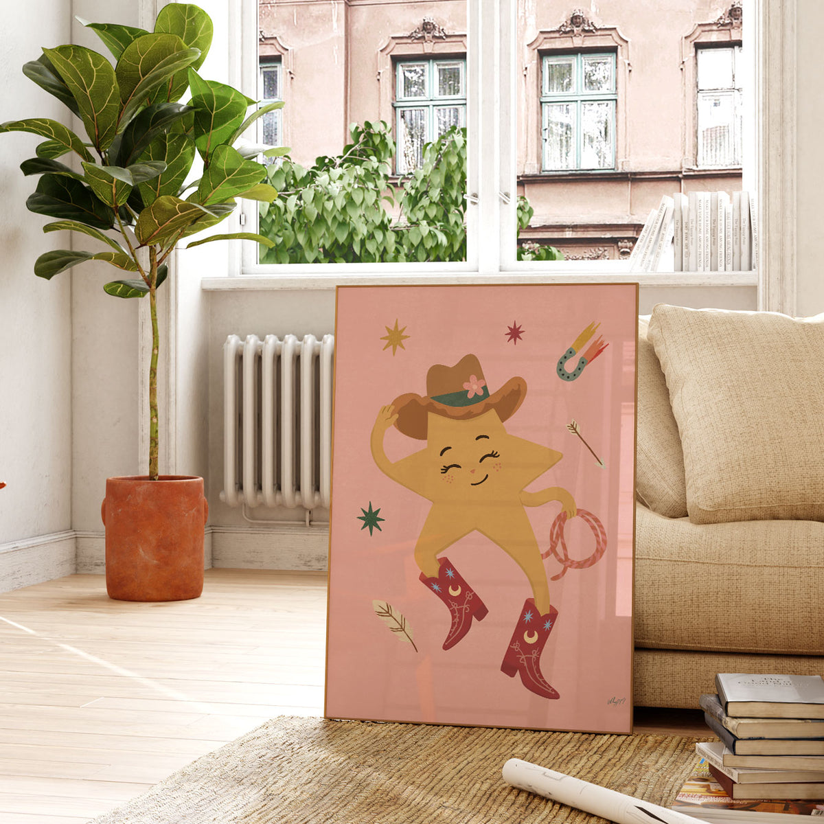 Illustrated yellow star with a face wearing a cowboy hat and red cowboy boots, holding a lasso, on a soft pink background.