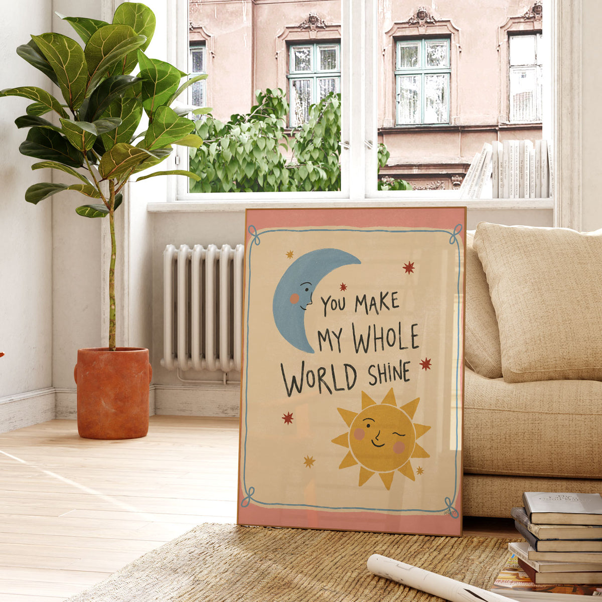 Hand-lettered quote reading You Make My Whole World Shine with a smiling sun and crescent moon, on a warm pink background.