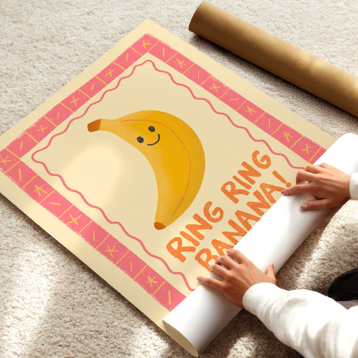 Playful kids wall art featuring a yellow banana character inside a colourful pink and coral frame.
