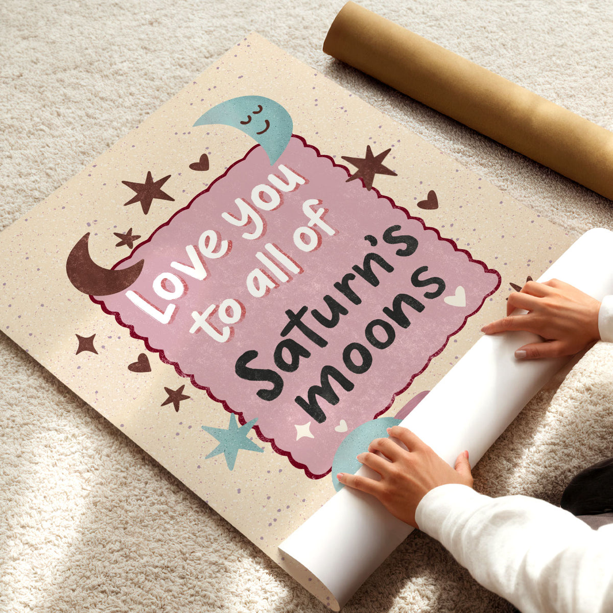 Hand-drawn Saturn and moon nursery poster with a playful love quote in pink, aqua and burgundy tones.