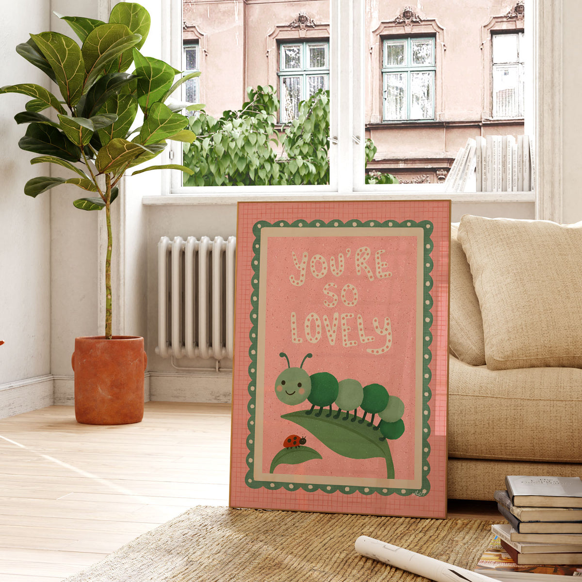 Positive kids wall art featuring You’re So Lovely lettering above a cheerful caterpillar sitting on a leaf.