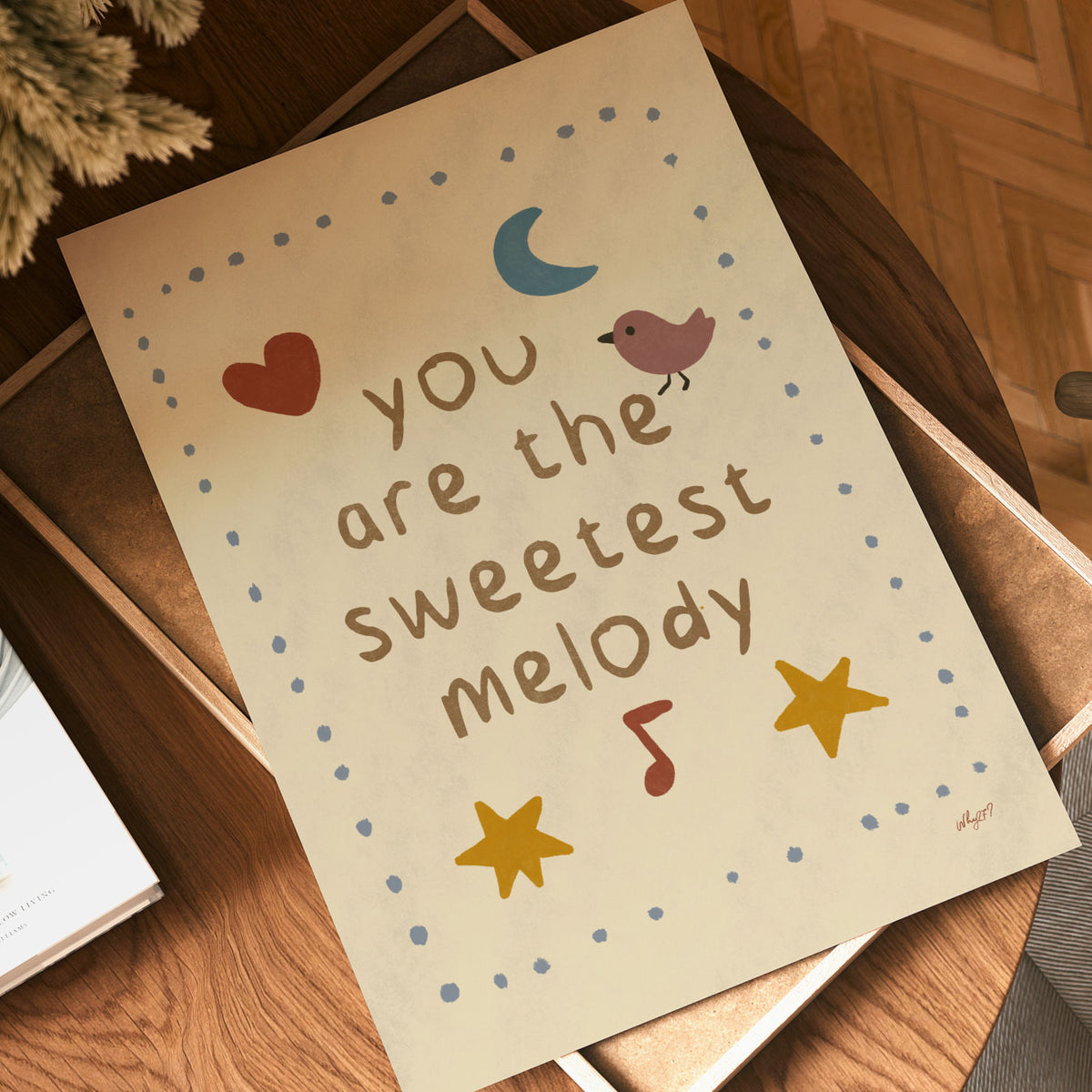 Sweetest Melody nursery poster with handwritten lettering, musical notes, stars and crescent moon.