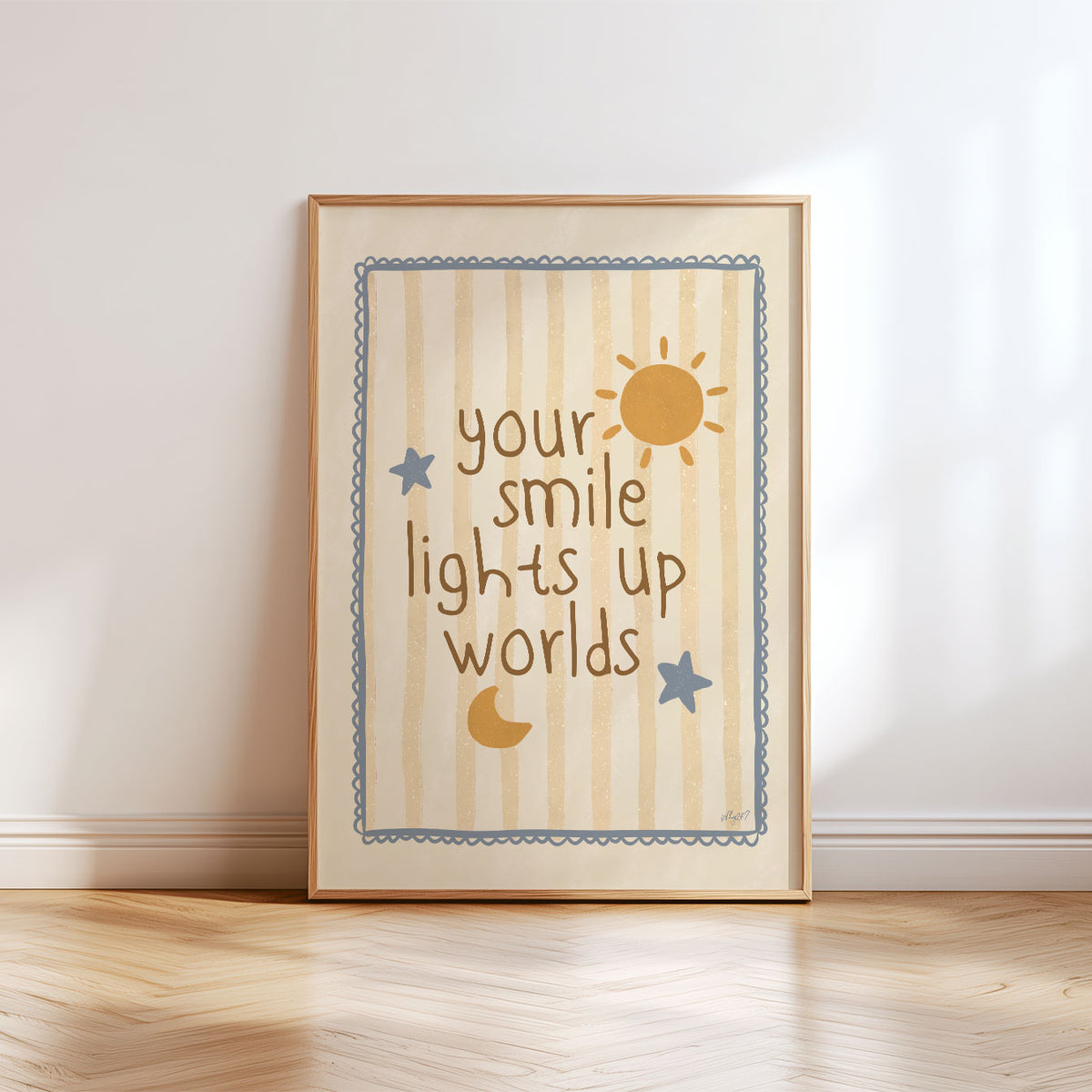 Positive kids wall art featuring the words Your Smile Lights Up Worlds surrounded by sun, moon and stars.