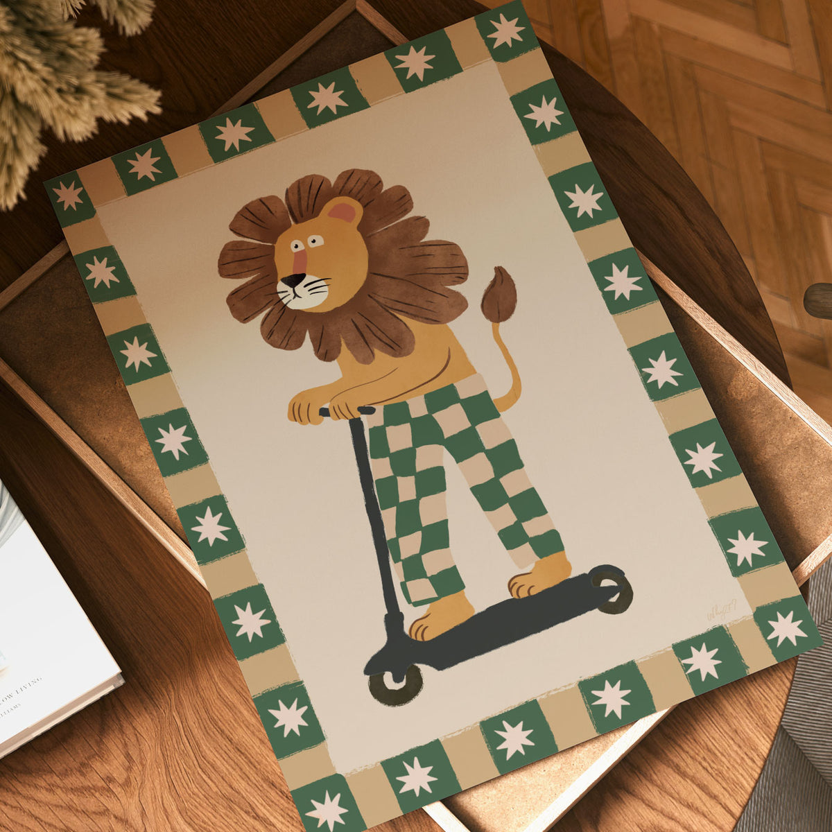 Kids scooter wall art with a whimsical lion wearing green checked trousers on a warm neutral background.