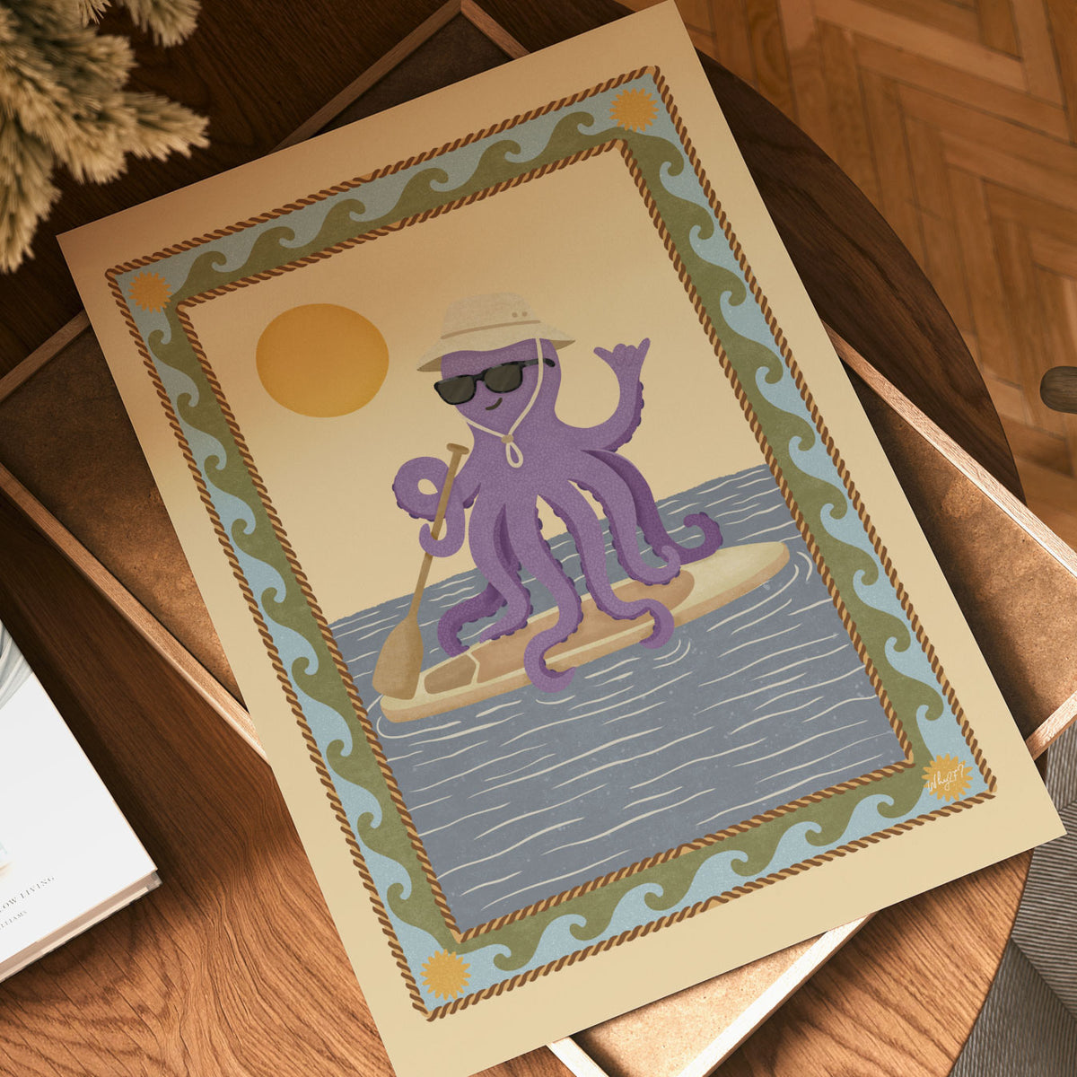 Hand-drawn purple octopus paddleboarding with a brown paddle, sunglasses and a sun hat.