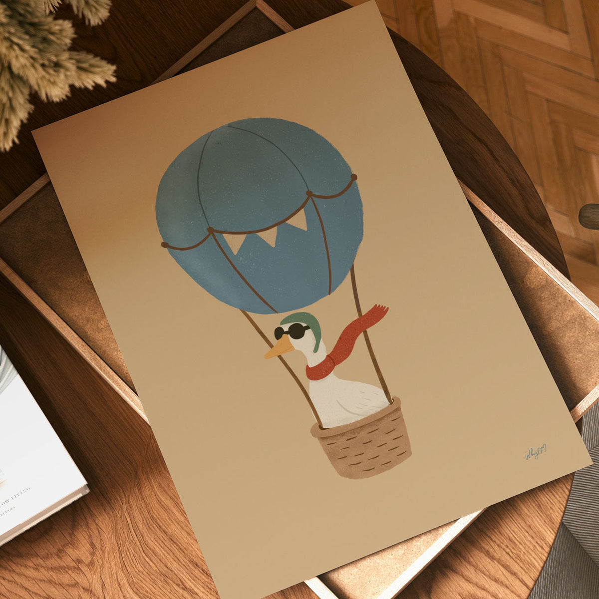 Hand-drawn goose wearing goggles and a flowing red scarf while riding in a hot air balloon basket.