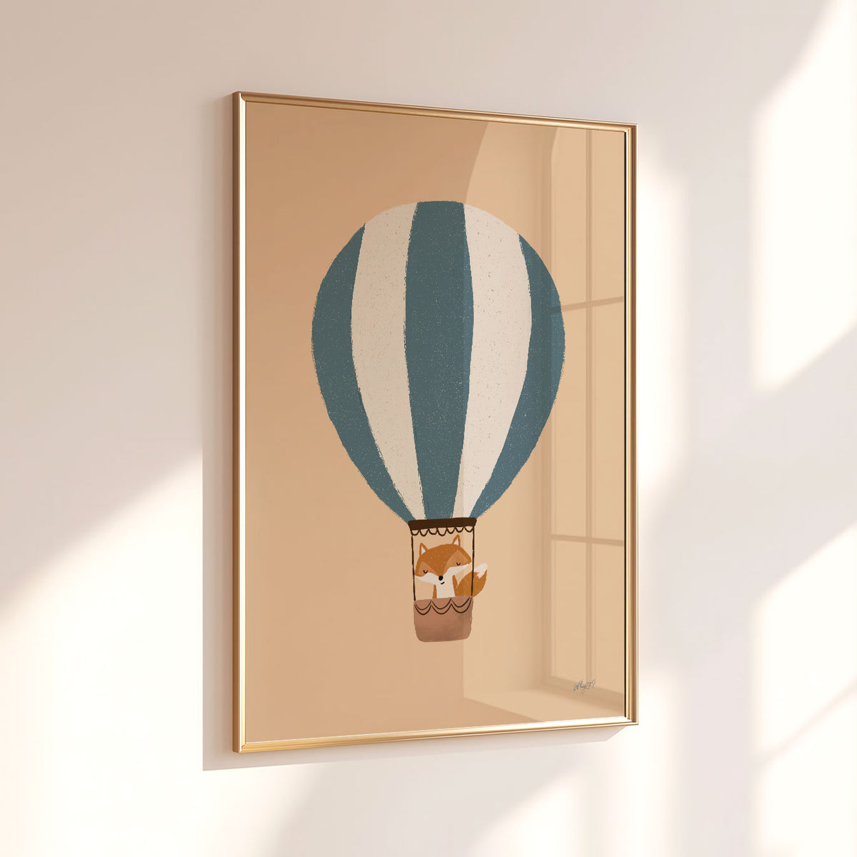 Hot air balloon nursery wall art with a little fox inside a brown basket beneath blue and cream stripes.
