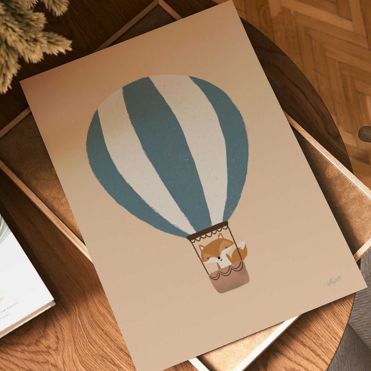 Minimal kids wall art with a little fox flying in a blue striped hot air balloon on a neutral background.