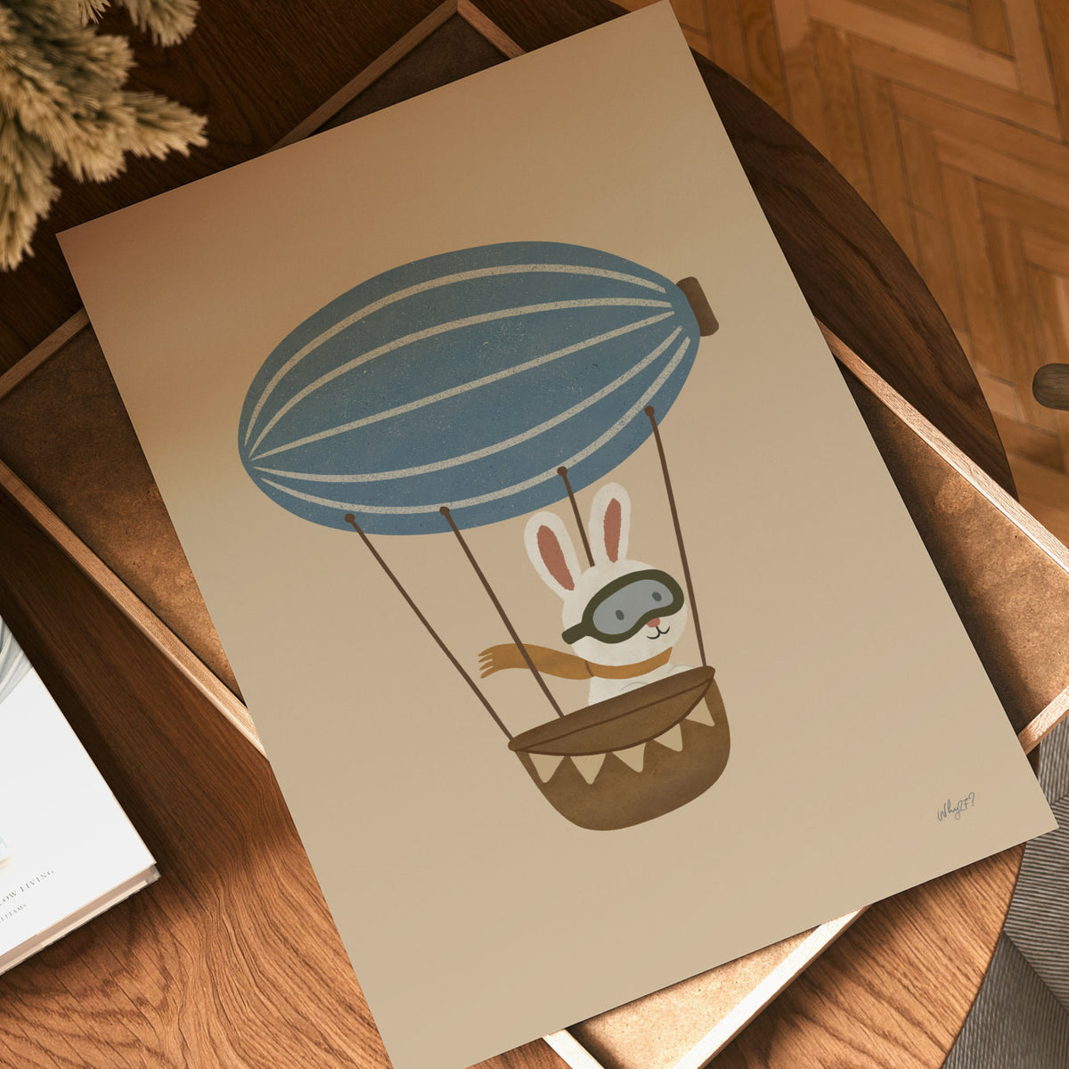 Whimsical rabbit flying an airship in dusty blue, cream and brown tones on a neutral background.