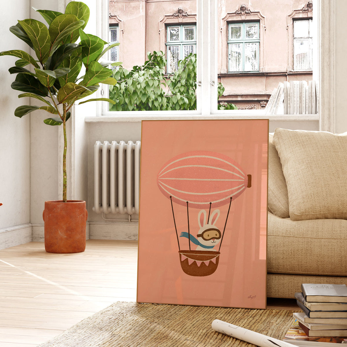 Whimsical rabbit flying in a pink hot air balloon with a patterned brown basket.