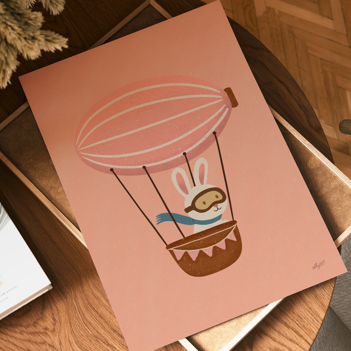 Bunny hot air balloon poster featuring a little rabbit adventurer flying against a warm coral pink background.