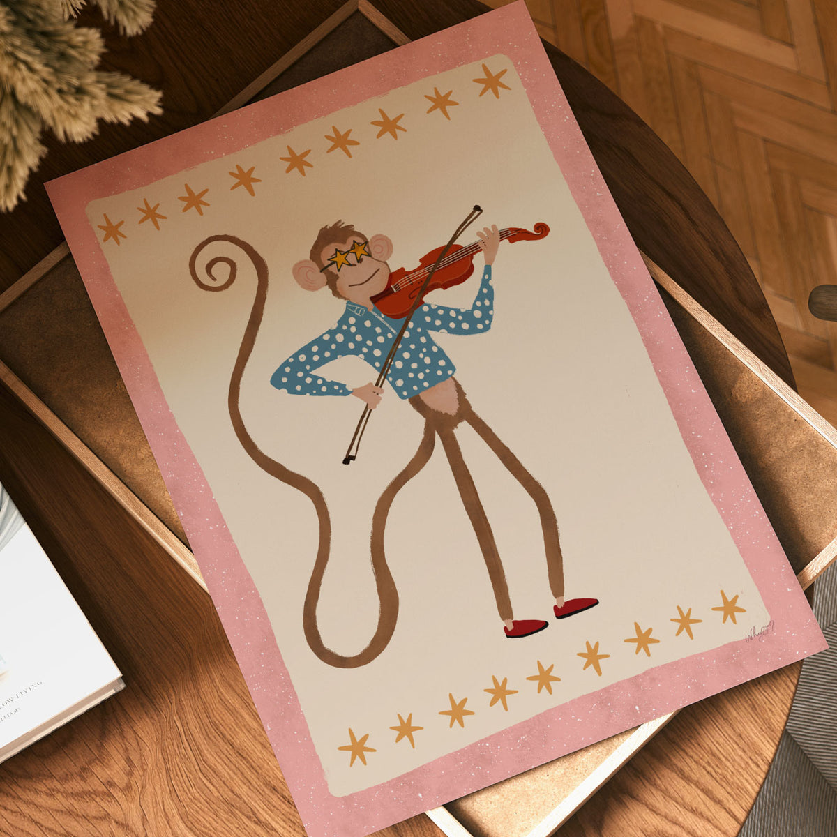 Hand-drawn monkey musician playing violin and bow against a warm cream background with pink frame.