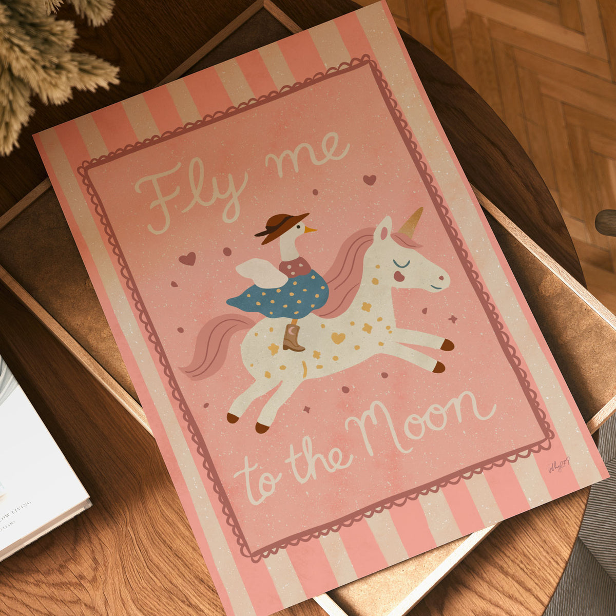 Unicorn kids wall art featuring a child riding a magical flying unicorn surrounded by hearts and stars.