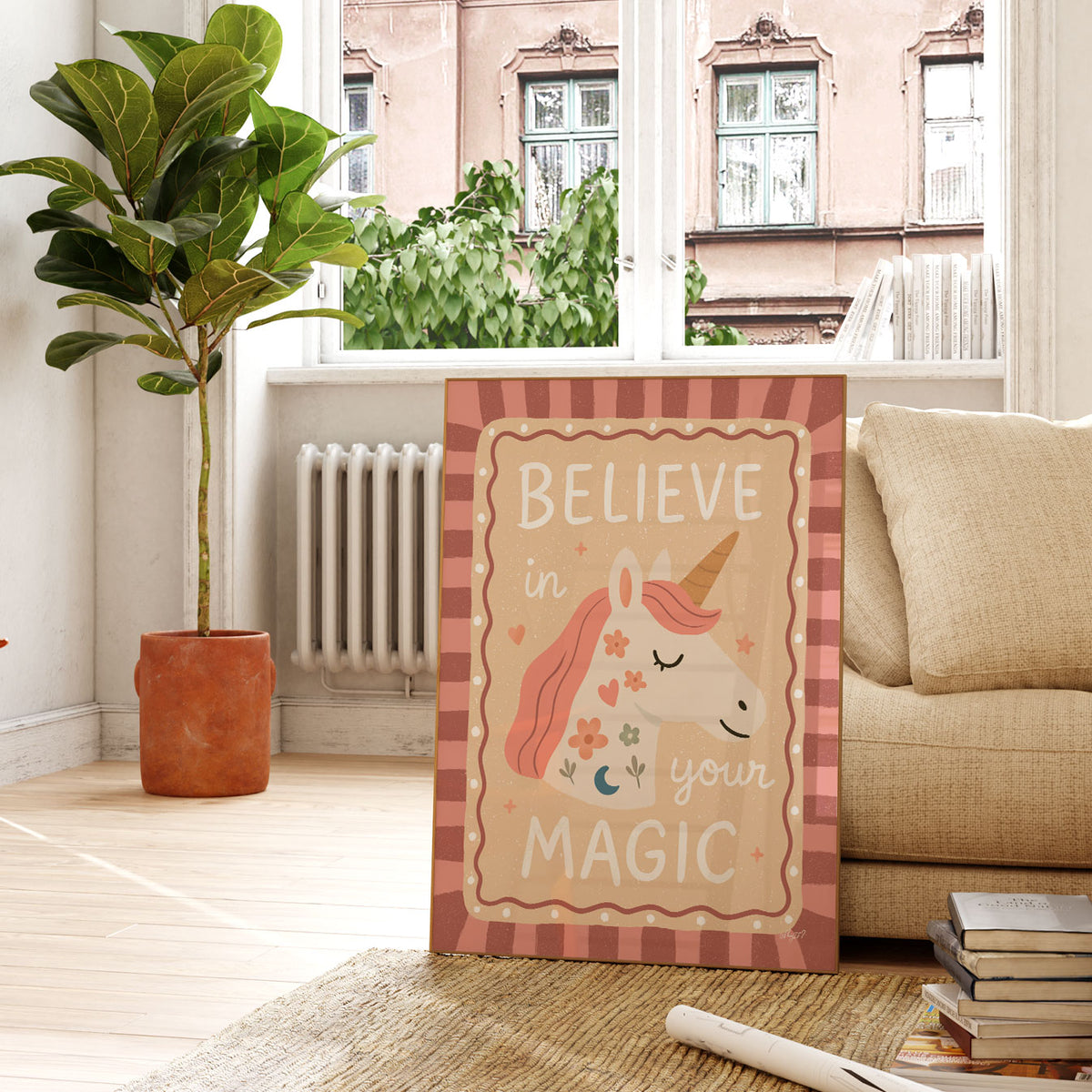 Believe in Your Magic unicorn wall art featuring a golden horn, pink mane and whimsical flower illustrations.