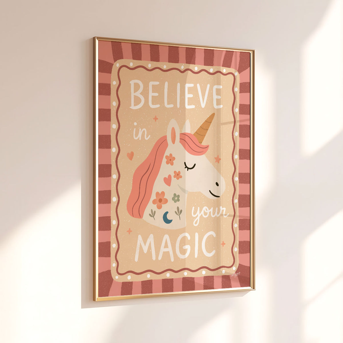 Positive kids wall art featuring Believe in Your Magic lettering around a pink-maned unicorn.