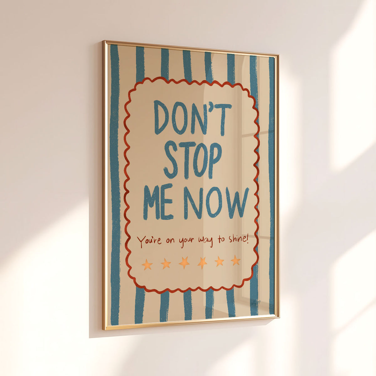 Retro-inspired motivational wall art with teal lettering, orange stars and irregular blue and cream stripes.